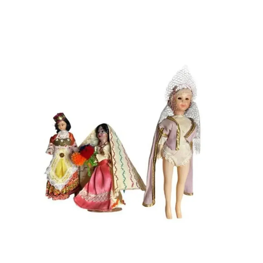 3 vintage dolls of different ethnic backgrounds